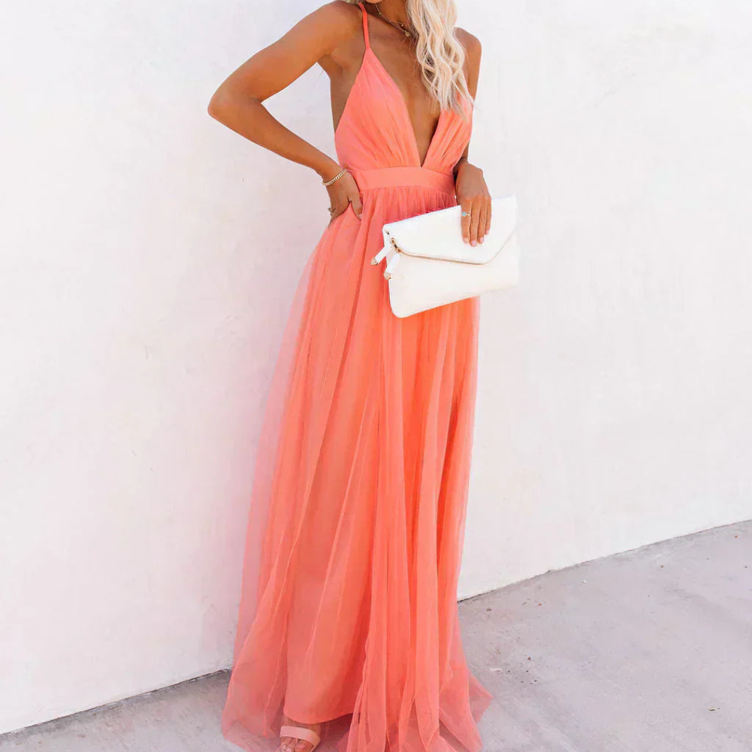 "La Chispa | Vestido Maxi Luz Coral" can be translated into Spanish from Spain as:

"La Chispa | Vestido Maxi Luz Coral" (The title is already in Spanish and does not require translation.) 

If you meant to ask for a different style or variation of the ti