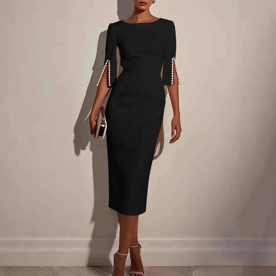 Nerina | VESTIDO ELEGANTE CON MANGAS ABIERTAS DECORADAS CON PERLAS