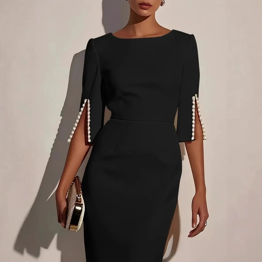 Nerina | VESTIDO ELEGANTE CON MANGAS ABIERTAS DECORADAS CON PERLAS