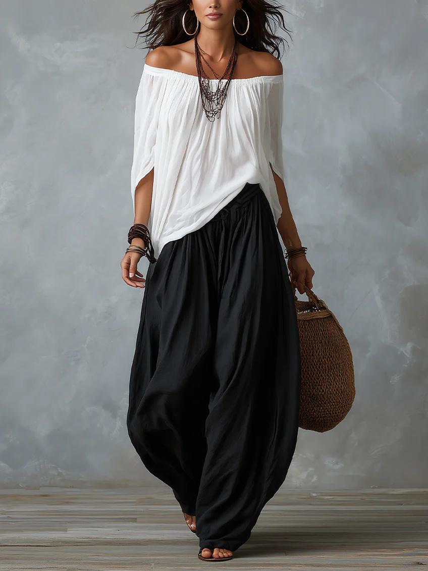 Conjunto blanco de hombros descubiertos y pantalón acampanado estilo linterna