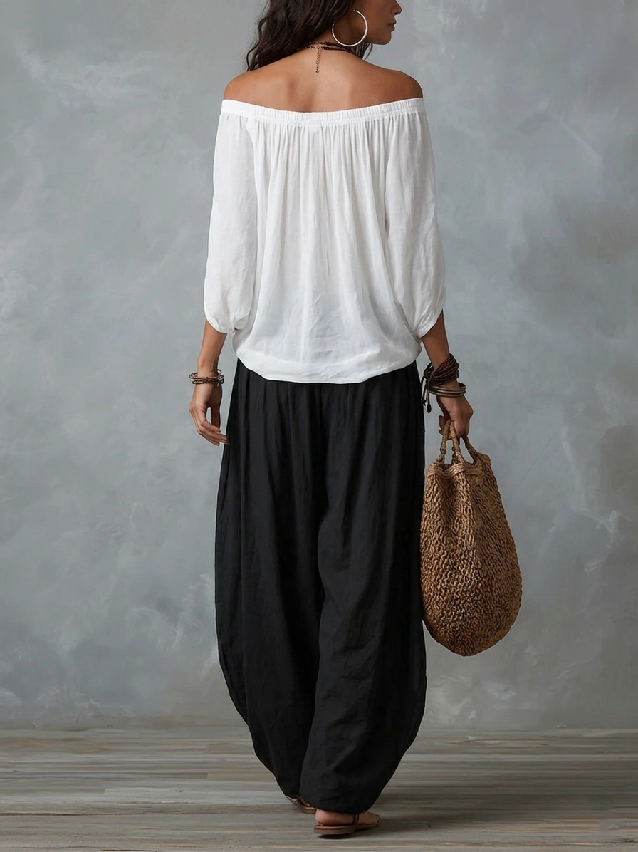 Conjunto blanco de hombros descubiertos y pantalón acampanado estilo linterna