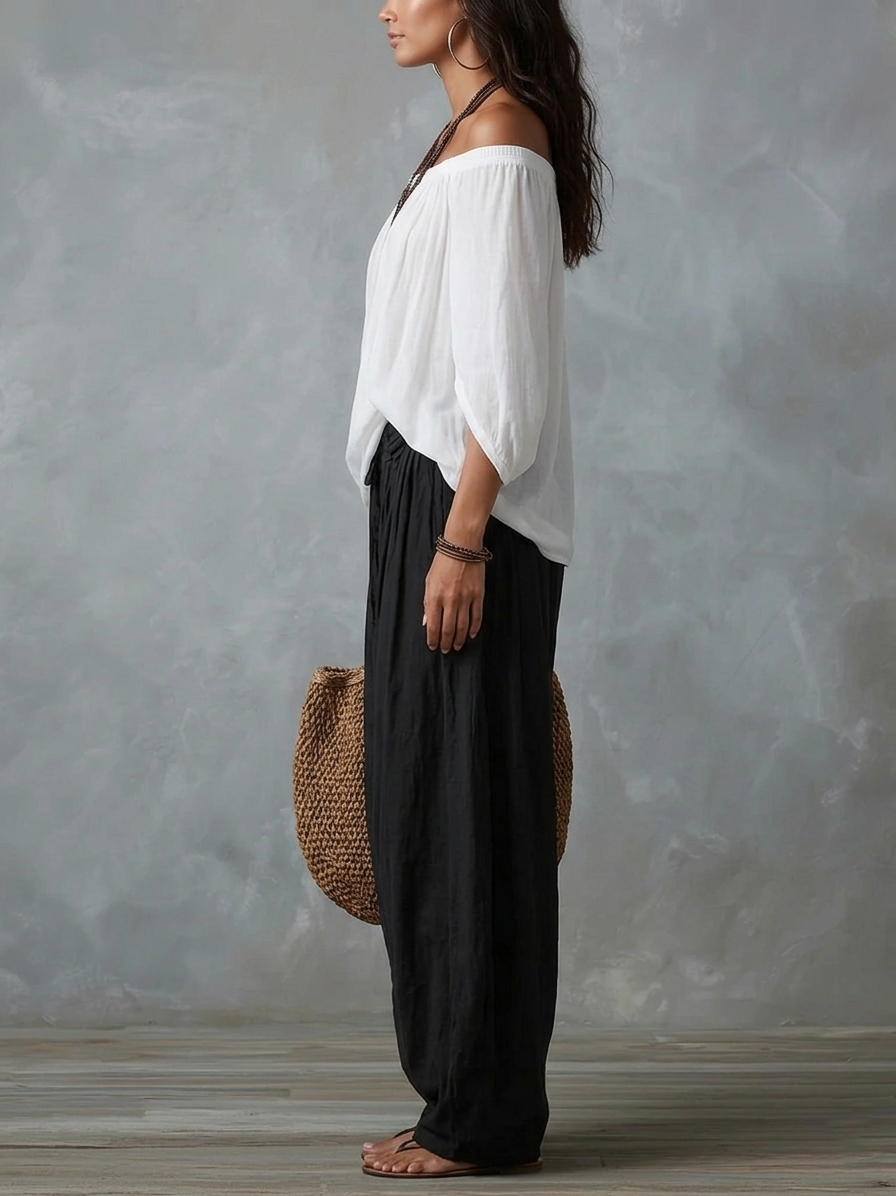 Conjunto blanco de hombros descubiertos y pantalón acampanado estilo linterna