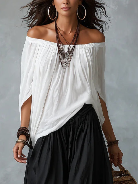 Conjunto blanco de hombros descubiertos y pantalón acampanado estilo linterna