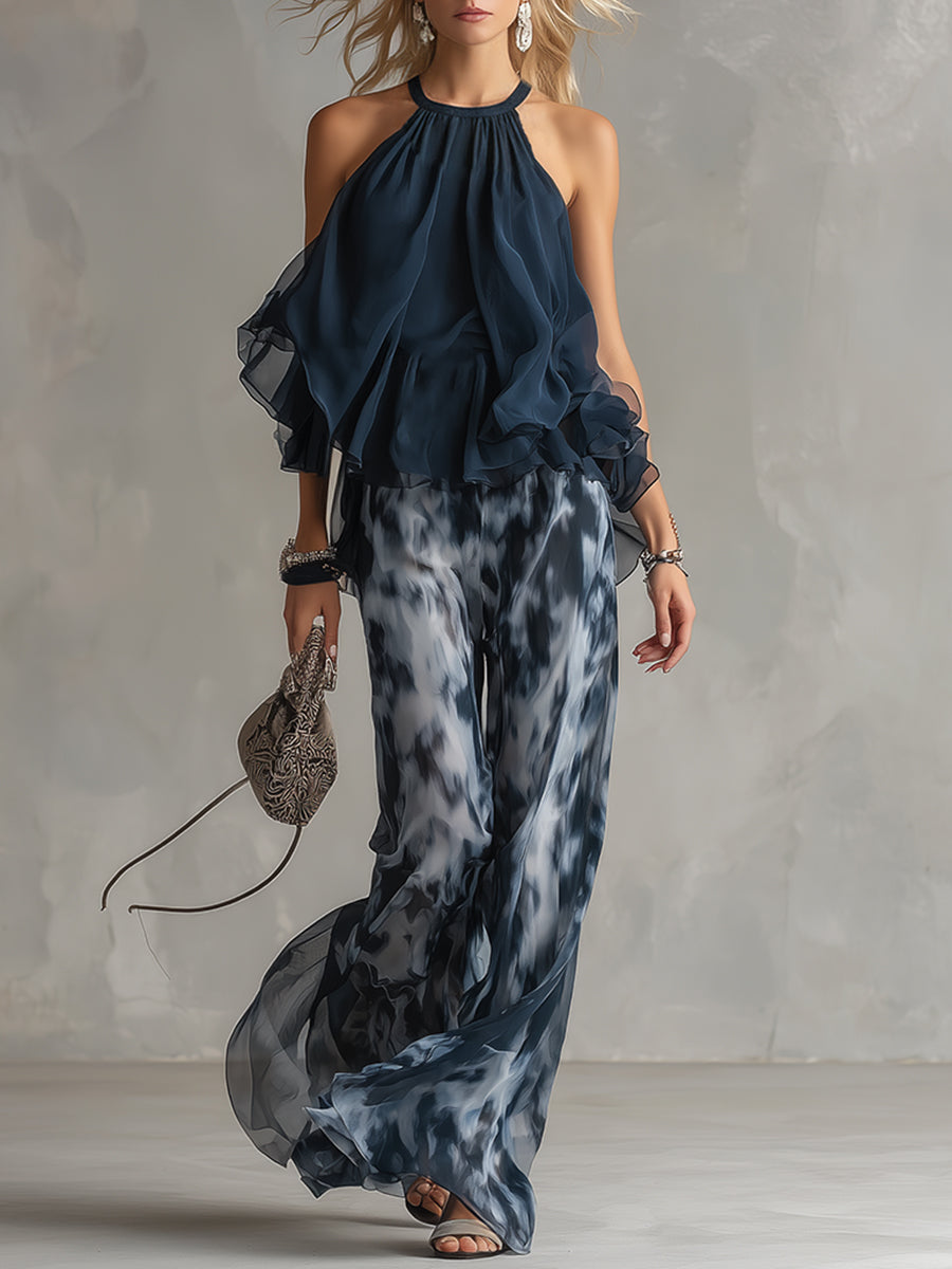 Ludovica - elegante vestido de gasa con corpiño de cuello alto y pantalón ancho estampado.