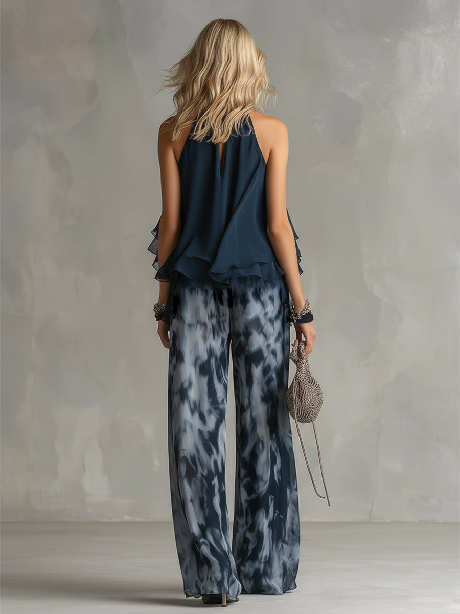 Ludovica - elegante vestido de gasa con corpiño de cuello alto y pantalón ancho estampado.