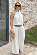 Set coordinato con scollo all'americana, bordino a contrasto e pantaloni a gamba larga